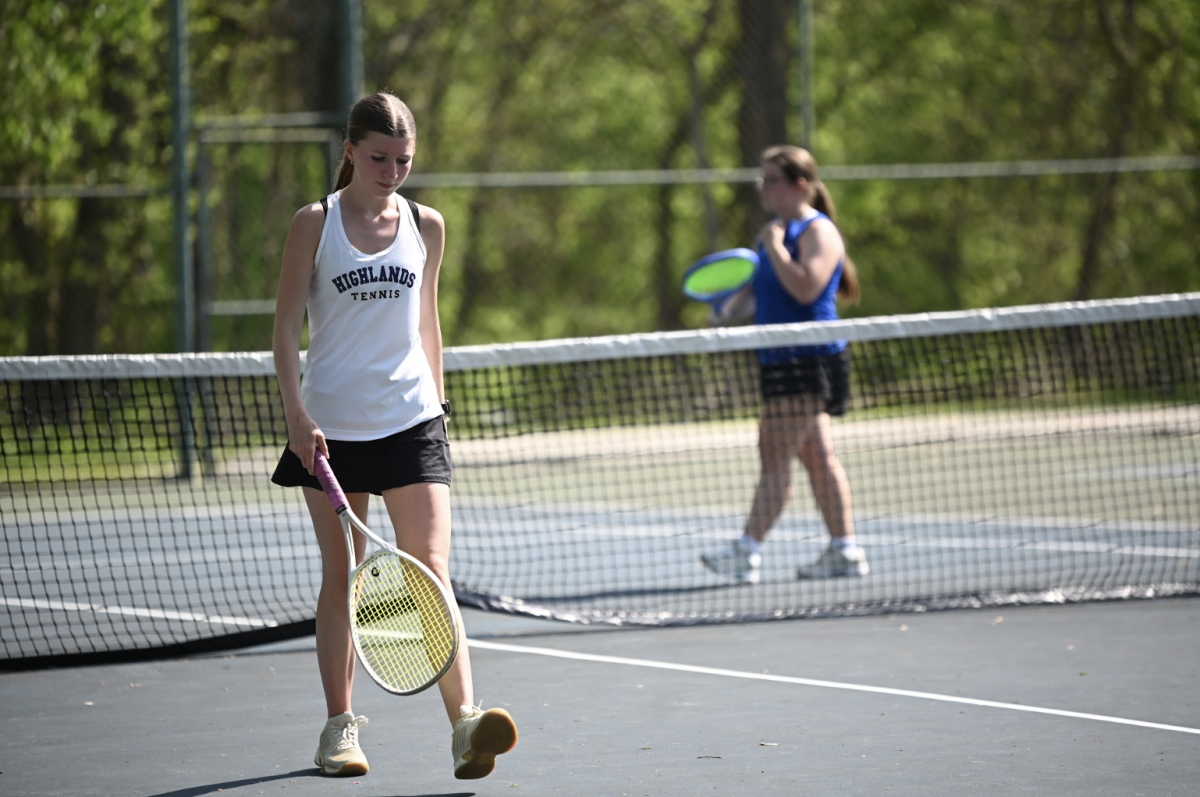 Elizabeth Zengel (11) walks back after winning the point. 